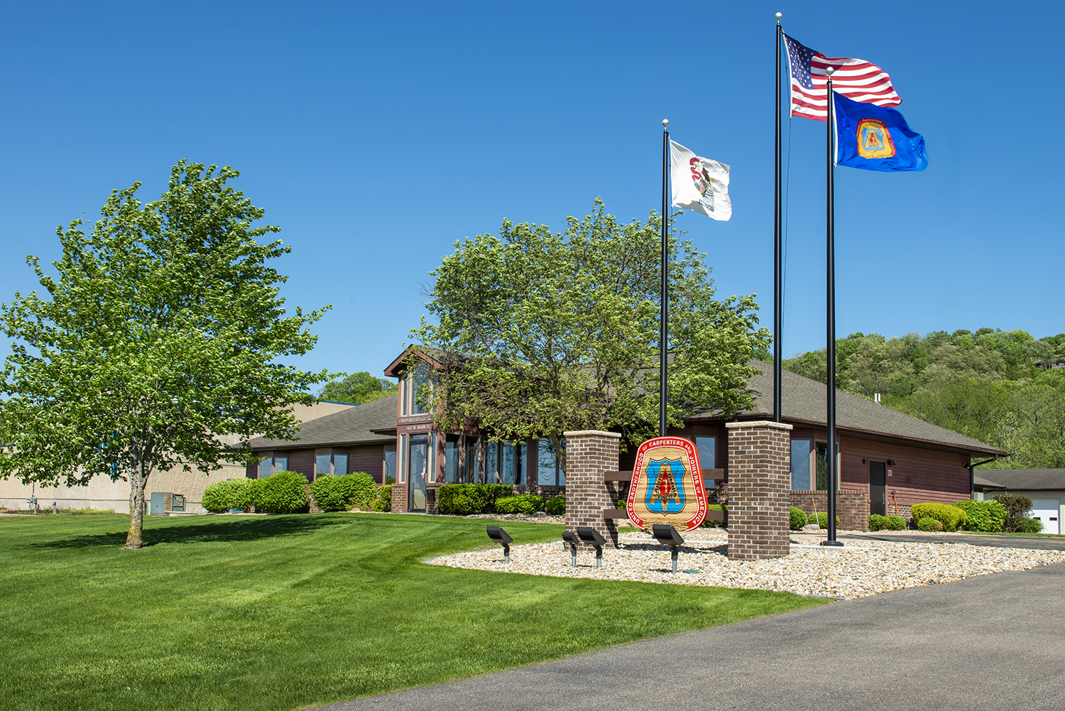 Carpenters Local 237 Union Hall Exterior with blue sky and flags flying